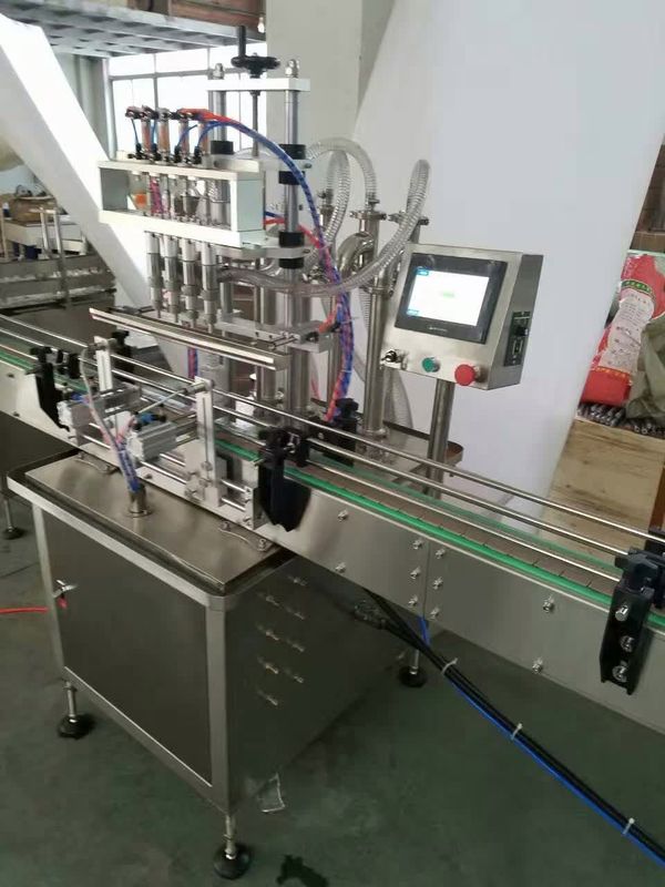 Çevrimiçi Doldurma Makinesi 4 nozel Sıvı Doldurma Makinesi Otomatik Aşınma İçecek Meyvesi İçin Sıvı Şişe Doldurucu